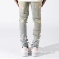 Jeans reparados de flacos blanqueados desteñidos